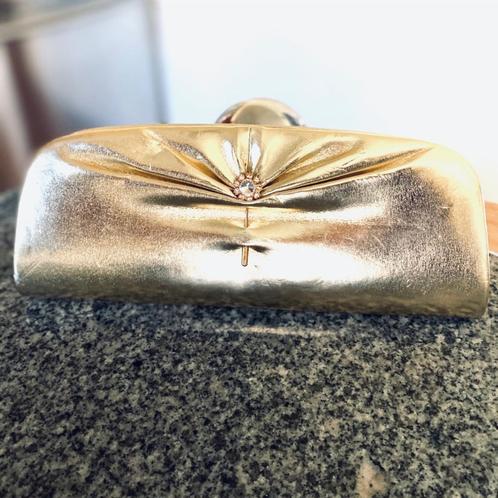 Gold clutch with classy pin